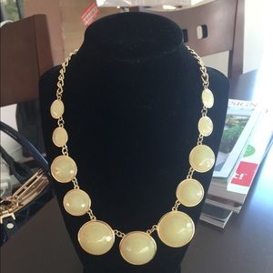 Gold tone necklace with beige beads